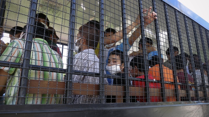 Suspected Uyghurs are transported back to a detention facility in the town of Songkhla in southern Thailand, March 26, 2014.